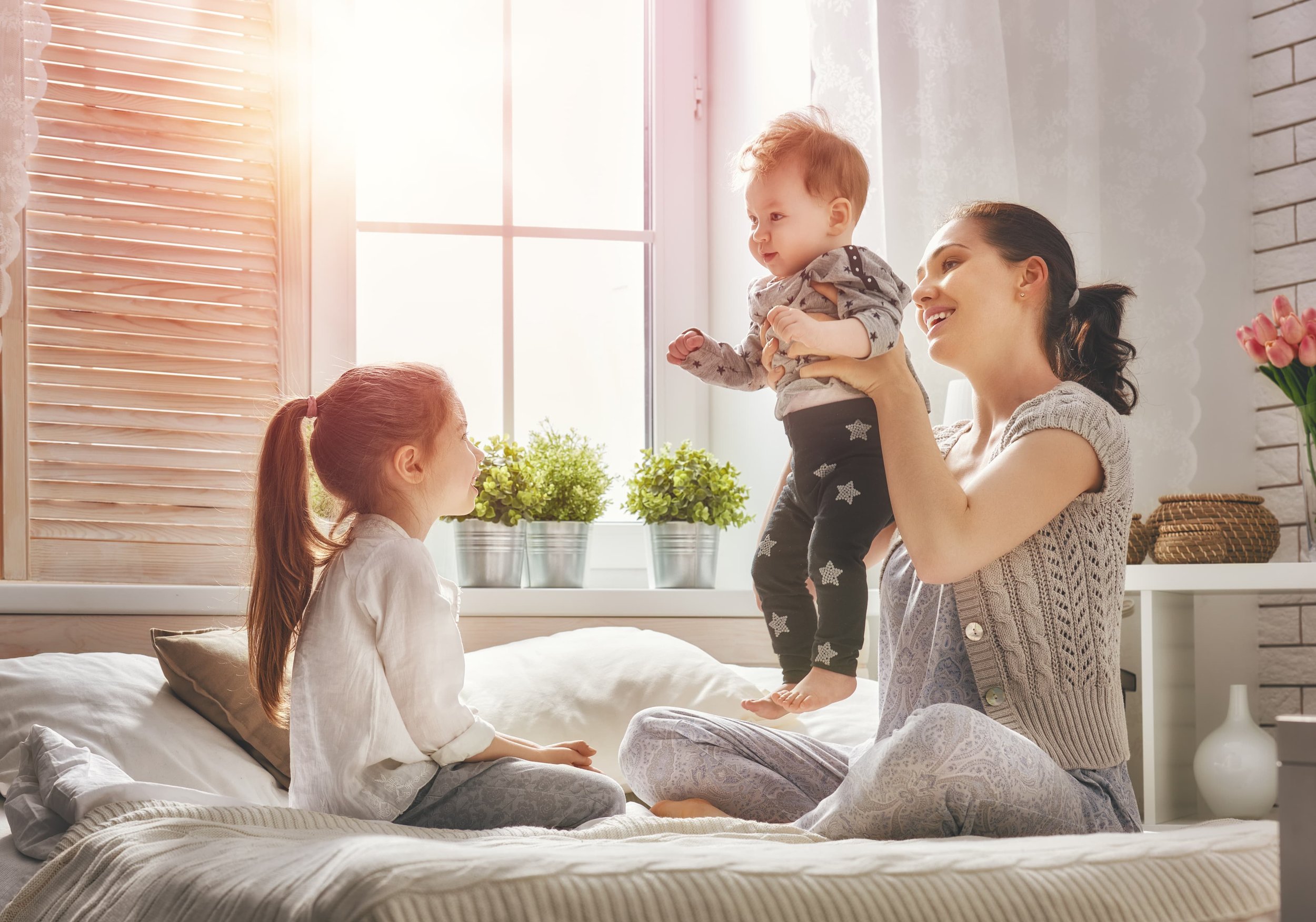 mother playing with her two kids