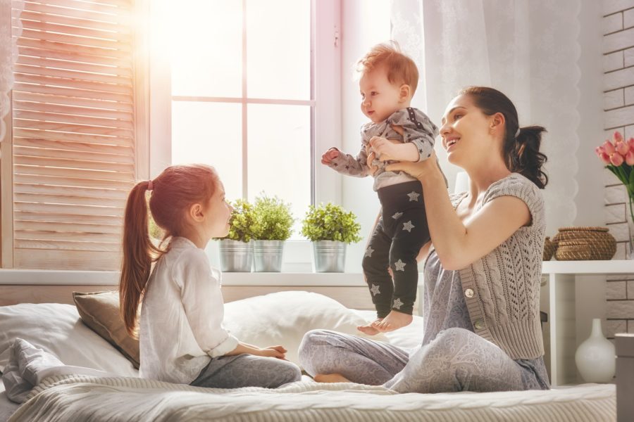 mother playing with her two kids